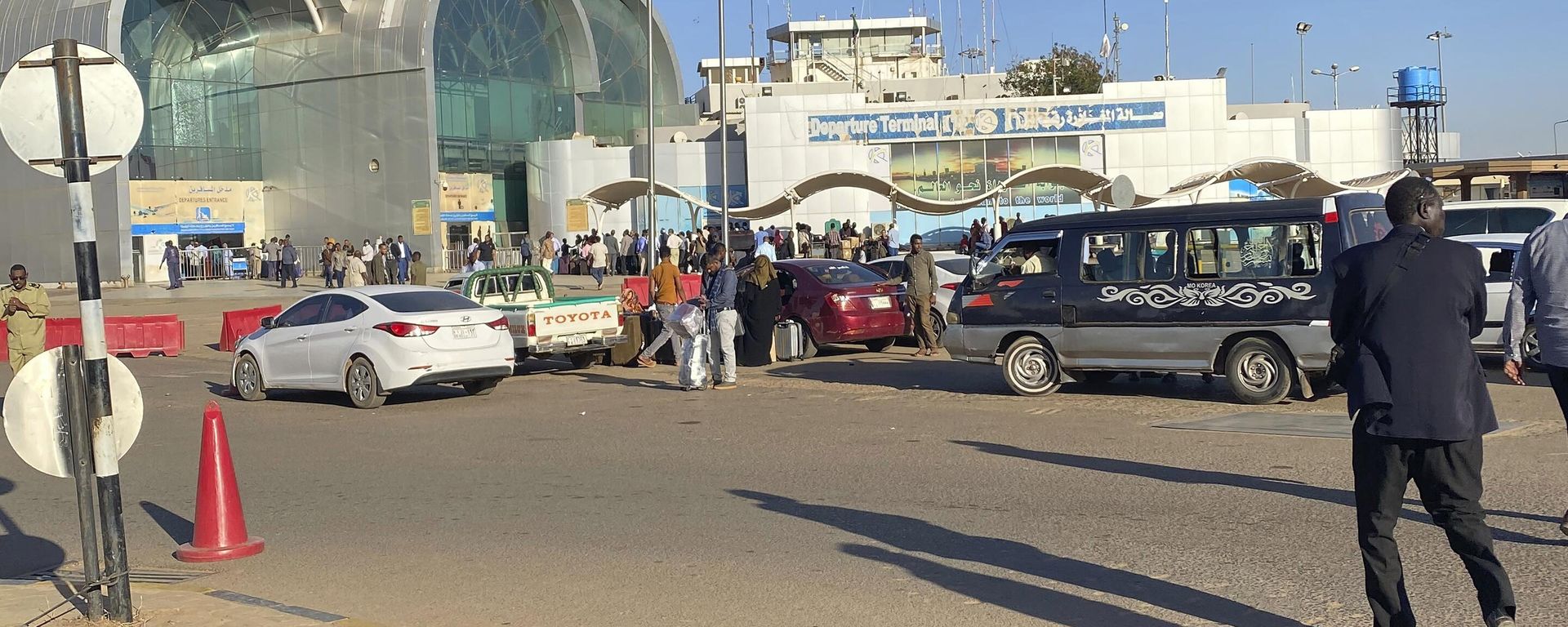 People wait outside Khartoum International Airport, in Khartoum, Sudan, Tuesday, Jan. 14, 2020. A Sudanese official said Tuesday, that security forces have contained an armed protest from within the security apparatus, amid reports of unrest. Earlier Tuesday, workers had told travelers at the airport in Sudan's capital that the facility will be closed temporarily.  - Sputnik International, 1920, 23.04.2023