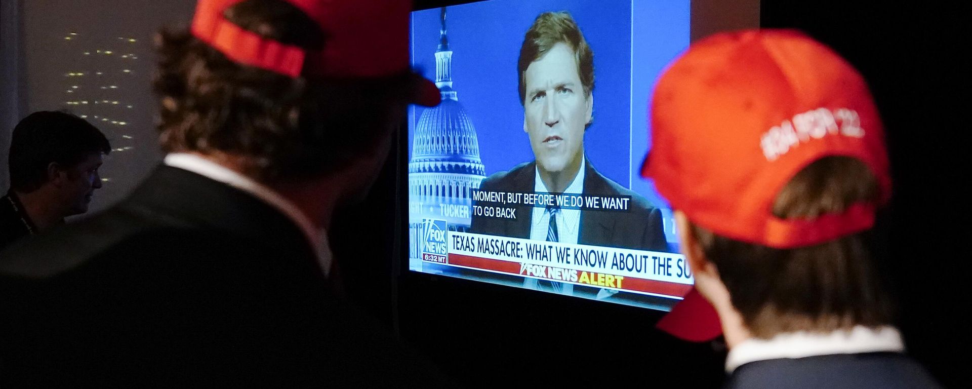 Supporters wait to hear U.S. Senate candidate Herschel Walker speak during an election night watch party as they watch TV host Tucker Carlson, May 24, 2022, in Atlanta - Sputnik International, 1920, 25.04.2023