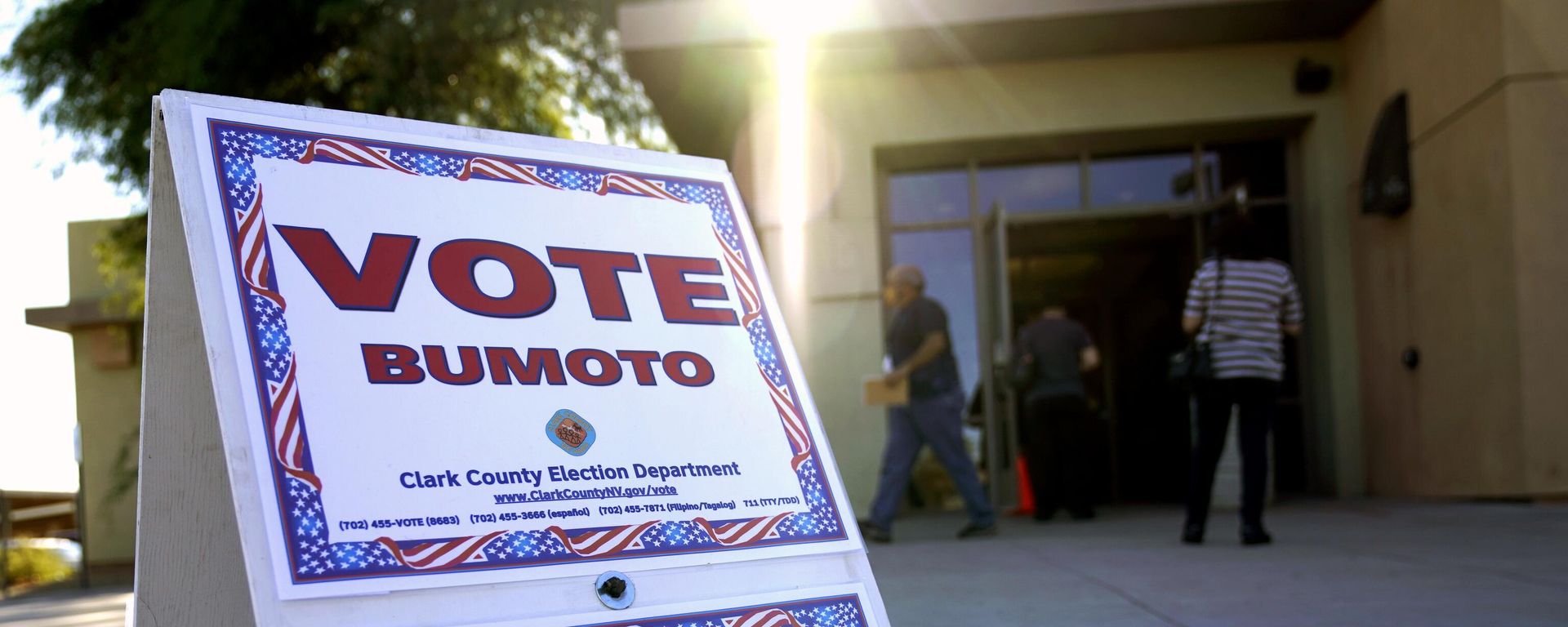 FILE - In this Oct. 30, 2020 file photo a sign directs people where to vote at a polling place during early voting in Las Vegas. A review by The Associated Press in the six battleground states disputed by former President Trump has found fewer than 475 cases of potential voter fraud, a minuscule number that would have made no difference in the 2020 presidential election. Democrat Joe Biden won Arizona, Georgia, Michigan, Nevada, Pennsylvania and Wisconsin and their 79 Electoral College votes by a combined 311,257 votes out of 25.5 million ballots cast for president. - Sputnik International, 1920, 29.04.2023