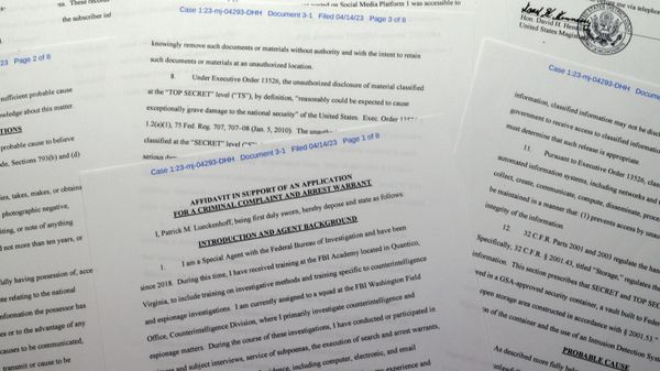The criminal complaint against Jack Teixeira is photographed Friday, April 14, 2023. The Massachusetts Air National Guardsman appeared in court in Boston, accused in the leak of highly classified military documents. - Sputnik International
