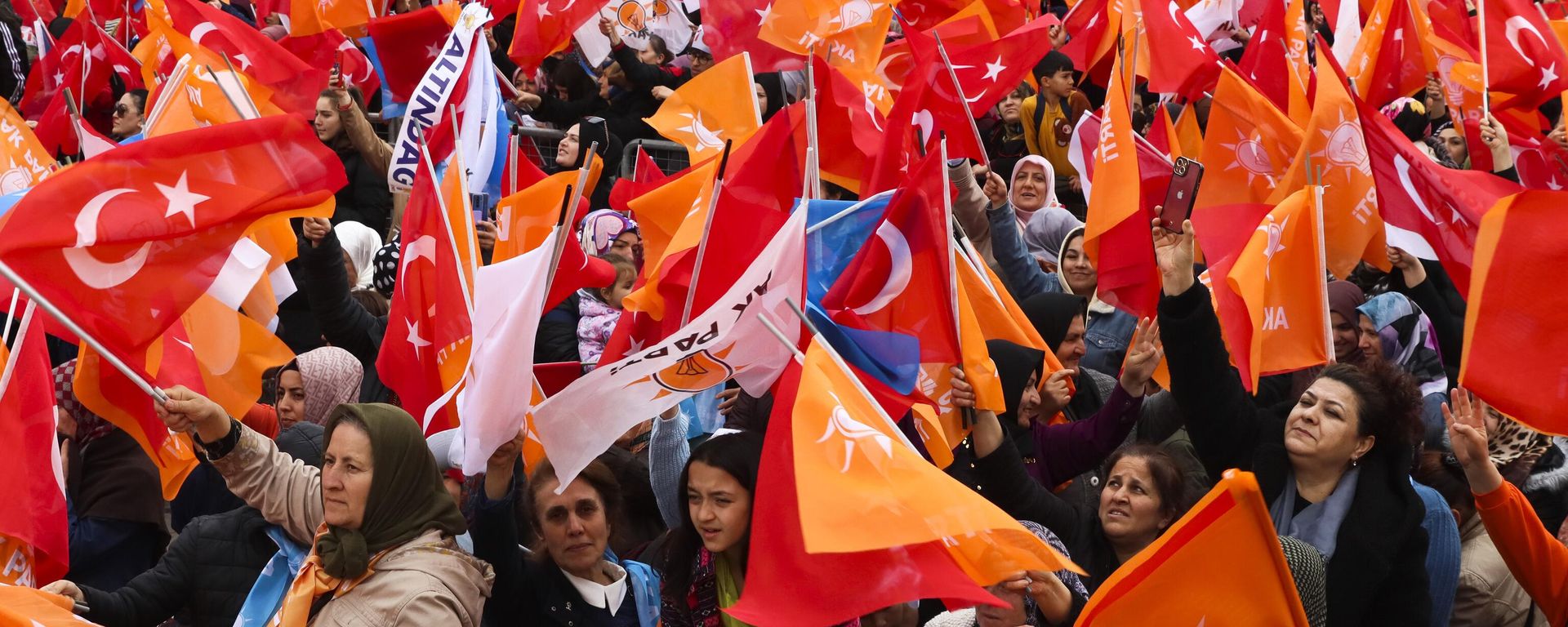 People waves Turkish and AK ruling party flags as they listen to Turkish President and People's Alliance's presidential candidate Recep Tayyip Erdogan during an election campaign rally in Ankara, Sunday, April 30, 2023. Presidential elections in Turkey are scheduled to take place on May 14. - Sputnik International, 1920, 10.05.2023