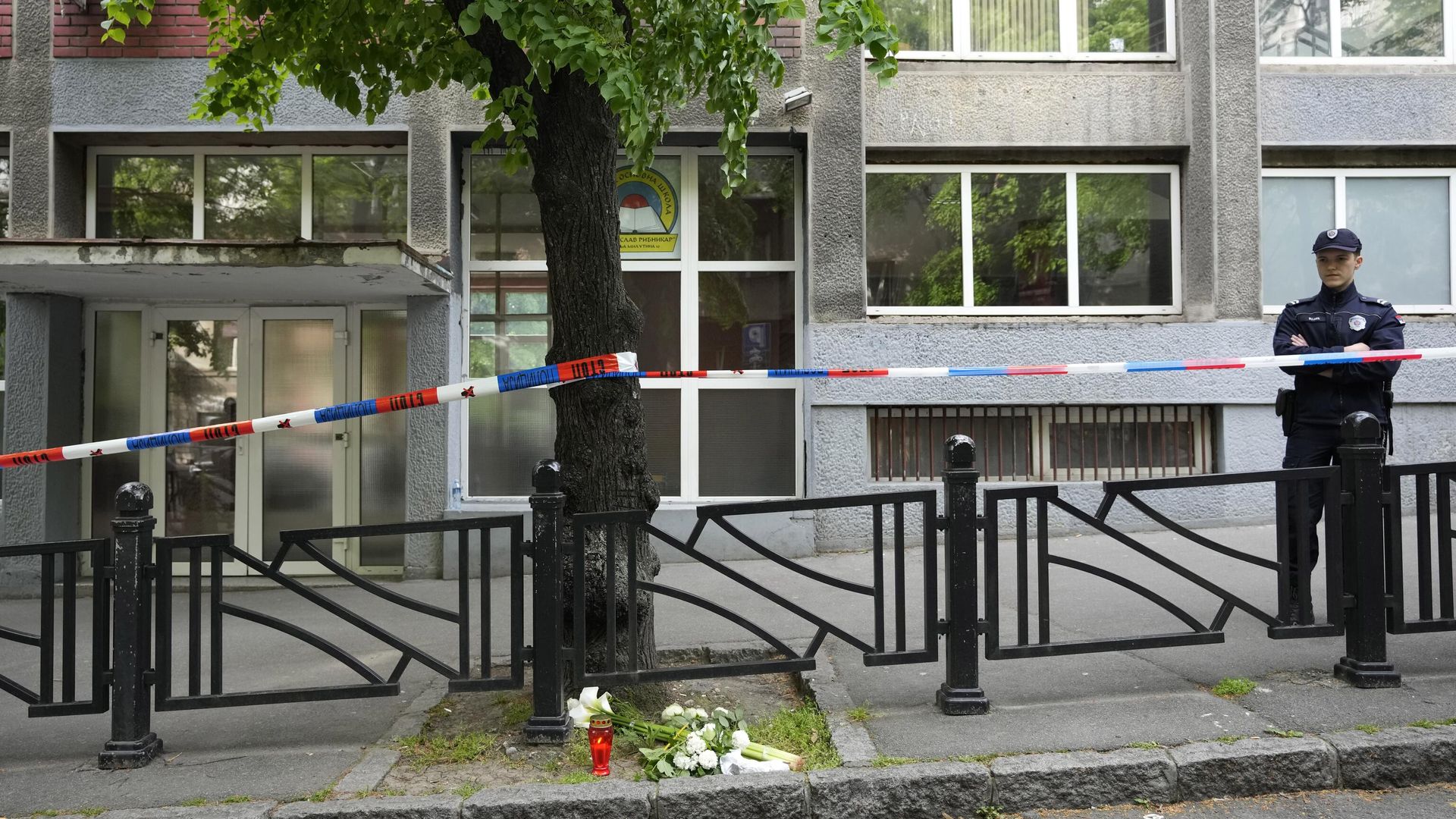 Policeman stands in front of the Ribnikar school in Belgrade, Serbia, Wednesday, May 3, 2023. Police say a 13-year-old who opened fire at his school drew sketches of classrooms and made a list of people he intended to target. He killed eight fellow students and a school guard before being arrested Wednesday. Policeman stands in front of the Ribnikar school in Belgrade, Serbia, Wednesday, May 3, 2023. Police say a 13-year-old who opened fire at his school drew sketches of classrooms and made a list of people he intended to target. He killed eight fellow students and a school guard before being arrested Wednesday. - Sputnik International, 1920, 03.05.2023