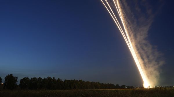 Israel's Iron Dome anti-missile system fires to intercept a rocket launched from the Gaza Strip towards Israel, near Sderot, Israel, Wednesday, May 10, 2023. - Sputnik International