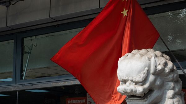 A view shows Chinese national flags in a street of an old neighbourhood as the city prepares for the 20th National Congress of the Communist Party of China, in Beijing - Sputnik International