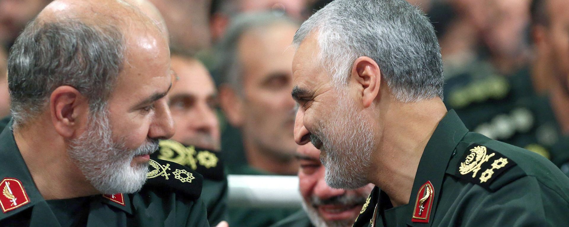 An undated handout picture obtained from the office of Iran's Supreme Leader Ayatollah Ali Khamenei on May 22, 2023, shows Revolutionary Guards general Ali Akbar Ahmadian (L) speaking with slain Iranian Major-General Qasem Soleimani during a meeting in Tehran. Iran's President Ebrahim Raisi on May 22 appointed Ahmadian as the new secretary of the Supreme National Security Council, replacing longtime chief and leading Gulf mediator Ali Shamkhani. An undated handout picture obtained from the office of Iran's Supreme Leader Ayatollah Ali Khamenei on May 22, 2023, shows Revolutionary Guards general Ali Akbar Ahmadian (L) speaking with slain Iranian Major-General Qasem Soleimani during a meeting in Tehran. Iran's President Ebrahim Raisi on May 22 appointed Ahmadian as the new secretary of the Supreme National Security Council, replacing longtime chief and leading Gulf mediator Ali Shamkhani. - Sputnik International, 1920, 22.05.2023