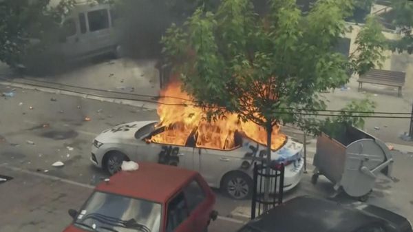 In this grab taken from video, a view of a car set on fire as KFOR soldiers clash with Kosovo Serbs in the town of Zvecan, northern Kosovo.  - Sputnik International