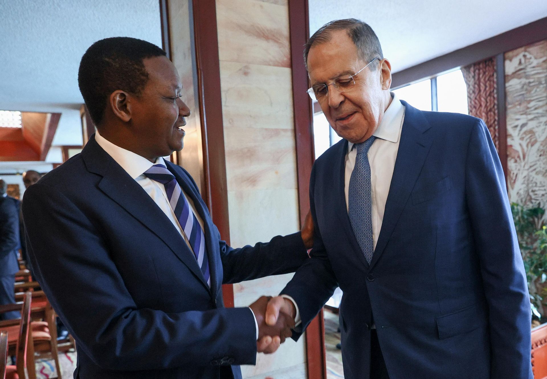 In this handout photo released by the Russian Foreign Ministry, Russian Foreign Minister Sergey Lavrov shakes hands with Kenya's Foreign Minister Alfred Mutua during a meeting in Nairobi, Kenya. - Sputnik International, 1920, 03.06.2023