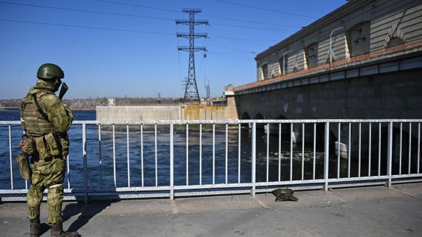 Russian serviceman guards the Hydro Power Plant in Novaya Kakhovka, Kherson Region. Russian serviceman guards the Hydro Power Plant in Novaya Kakhovka, Kherson Region. - Sputnik International