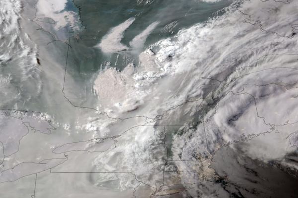 In this GOES-16 GeoColor satellite image taken Monday, June 5, 2023 at 7 p.m. EDT and provided by CIRA/NOAA, smoke from wildfires burning in Quebec, Canada, top center, drifts southward. - Sputnik International
