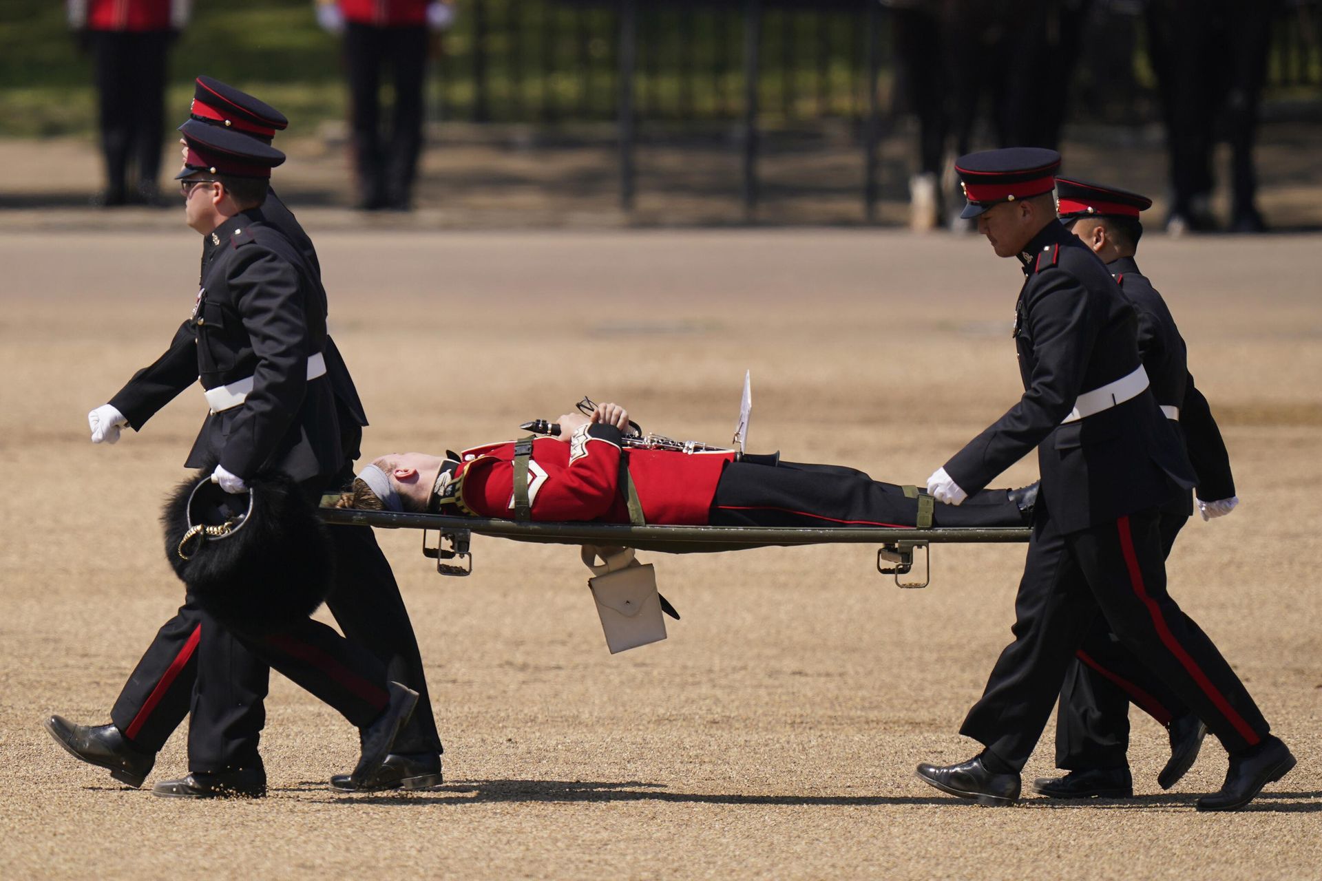 A trombone player of the military band is carried out on a stretcher after a faint during the Colonel's Review, the final rehearsal of the Trooping the Colour, the King's annual birthday parade, at Horse Guards Parade in London, Saturday, June 10, 2023. - Sputnik International, 1920, 11.06.2023