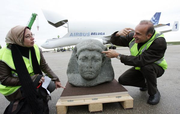 French archaeologist Franck Goddio (R) and Egyptian curator Snaa Fouad Zaki (L) from Cairo's Museum, show the statue of Cesarion, upon its arrival aboard a Beluga plane from Cairo, at Roissy airport, near Paris, 16 November 2006. The black granite statue, shown in Paris museum, le Grand Palais  in the exhibition "Tresors engloutis d'Egypte" (Egyptian immersed treasures), from 09 December 2006 to 14 March 2007, was found at the port of Alexandria by Goddio. Ptolemee XV, better known as Cesarion, is the illegal son of Cleopatra, Queen of Egypt (from -51 to -30 before J.C) and was killed by Roman Emperor Octavius.  - Sputnik International