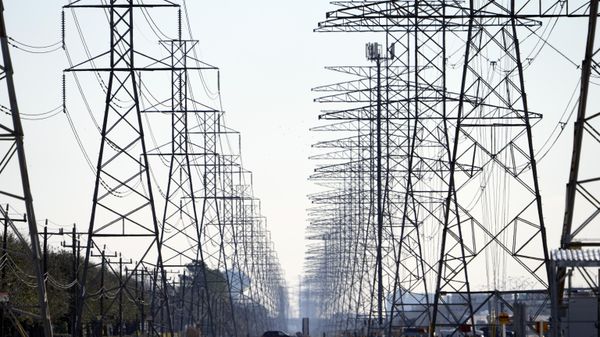 FILE - This Tuesday, Feb. 16, 2021, file photo shows power lines in Houston. In a letter, Tuesday, July 6, 2021, one month after declaring the state's electric power grid fixed, Republican Gov. Greg Abbott is demanding aggressive action from state utility regulators to shore up that grid.  - Sputnik International