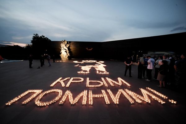 The international action "Flaming Pictures of War," timed for the Day of Memory and Sorrow, at a memorial to the victims of the fascist occupation of Crimea in the village of Mirnoye, Simferopol district. - Sputnik International