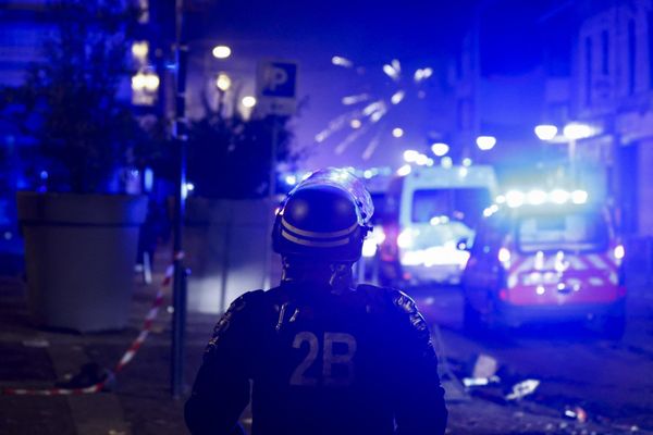 Fireworks explode as policemen stand by during protests in Roubaix, northern France. - Sputnik International