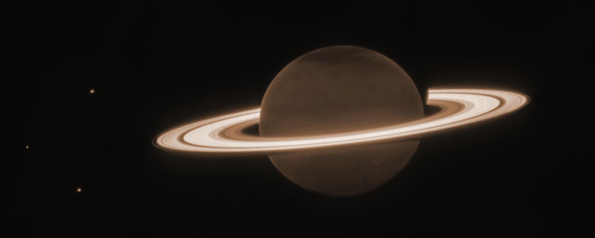 This June 2023 image provided by the Space Telescope Science Institute shows the planet Saturn and three of its moons, from left, Enceladus, Tethys and Dione, captured by the James Webb Space Telescope. - Sputnik International, 1920, 01.07.2023