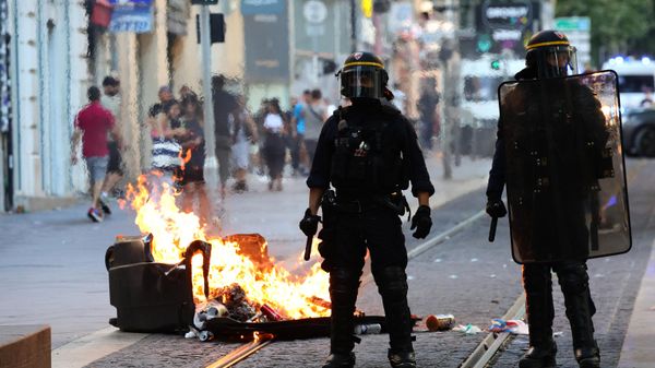 French riot police officers stand guard next to a burnt out trash bin during a demonstration against police in Marseille, southern France on July 1, 2023. - Sputnik International
