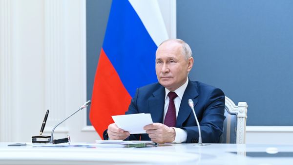 Russian President Vladimir Putin attends a meeting of the Shanghai Cooperation Organisation (SCO) Heads of State Council via a video conference at the Kremlin in Moscow, Russia. - Sputnik International