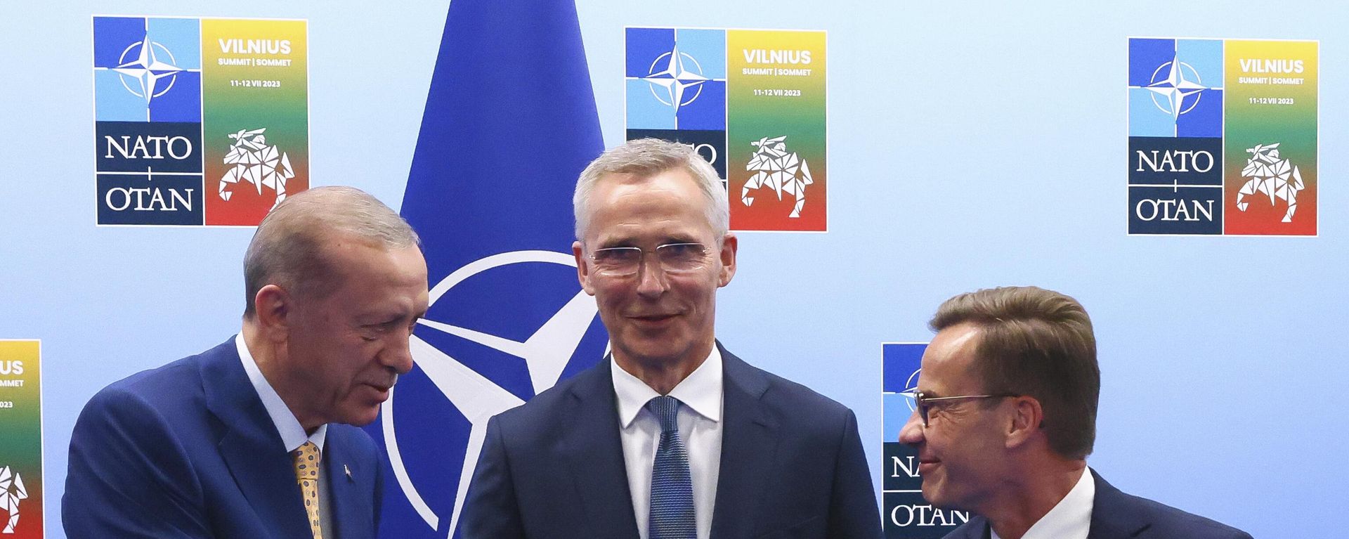 Turkiye's President Recep Tayyip Erdogan, left, shakes hands with Sweden's Prime Minister Ulf Kristersson, right, as NATO Secretary General Jens Stoltenberg looks on prior to a meeting ahead of a NATO summit in Vilnius, Lithuania, Monday, July 10, 2023. - Sputnik International, 1920, 10.07.2023