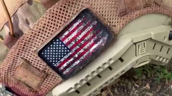 Screenshot from a video posted on Telegram, which allegedly depicts the aftermath of a clash between Russian military and a group of Kiev regime fighters that apparently included at least one foreign mercenary. - Sputnik International