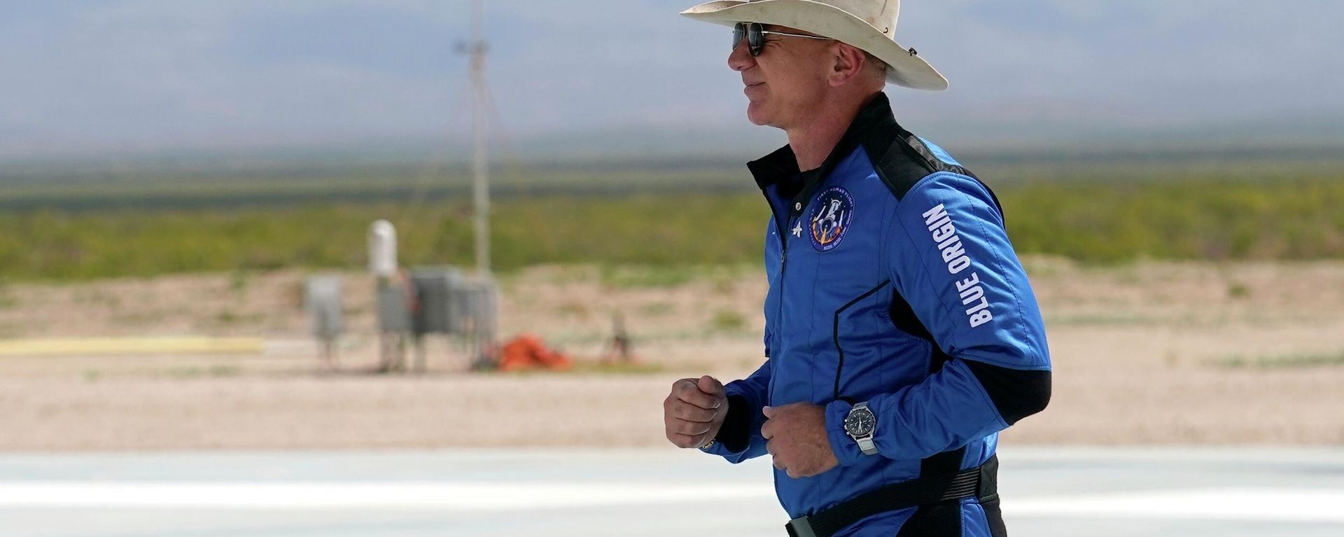 Jeff Bezos, founder of Amazon and space tourism company Blue Origin jogs onto the Blue Origin's New Shepard rocket landing pad to pose for photos at the spaceport near Van Horn, Texas, Tuesday, July 20, 2021.  - Sputnik International, 1920, 12.07.2023