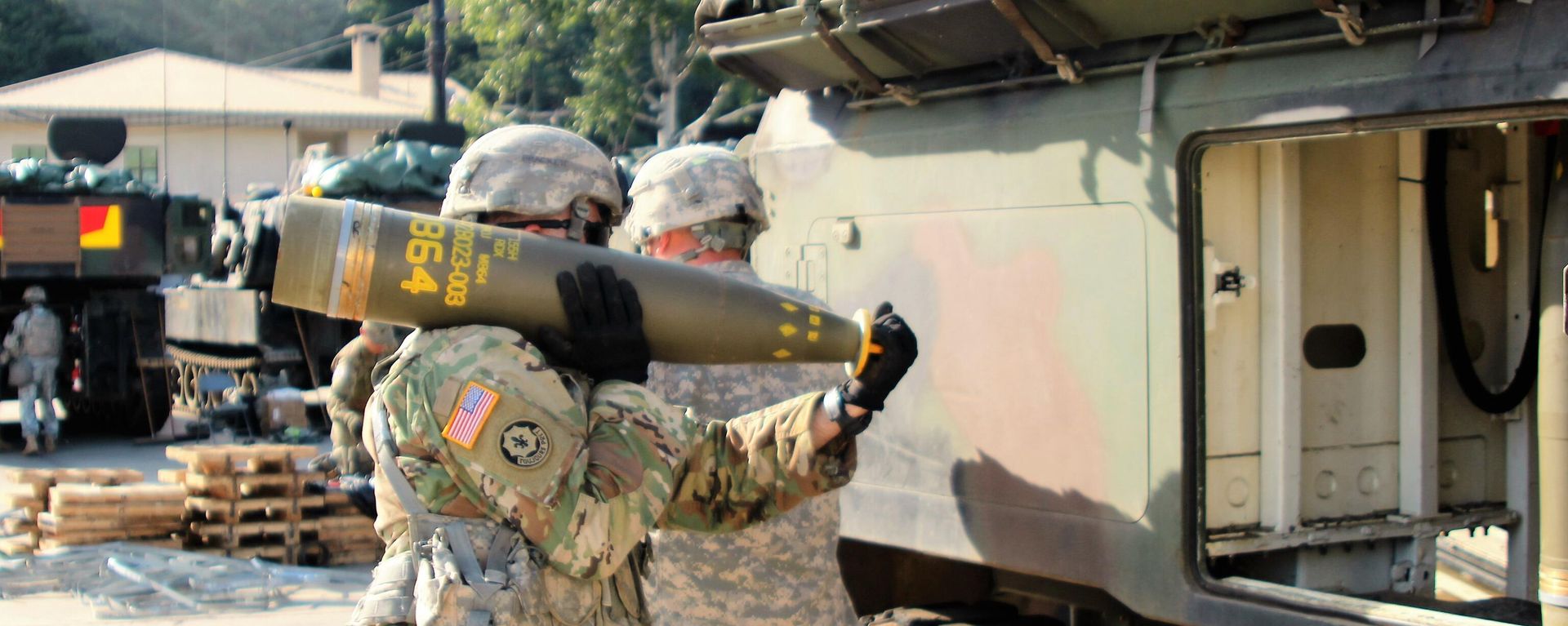 Soldiers from Alpha Battery, 1st Battalion, 82nd Field Artillery Regiment, 1st Armored Brigade Combat Team, 1st Cavalry Division, participate in a load exercise directed by the 210th Field Artillery Brigade, 2nd Infantry Division Sept. 20. They transported and loaded nearly 100 rounds during the exercise. Pictured: A Soldier carries a 155mm Base Burn Dual Purpose Improved Conventional Munition round, weighing more than 100 pounds, to a M992 Field Artillery Support Vehicle during the exercise. - Sputnik International, 1920, 13.07.2023