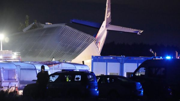 The tail of a Cessna 208 plane sticks out of a hangar after it crashed there in bad weather killing several people and injuring others, at a sky-diving centre in Chrcynno, central Poland, on Monday, July 17, 2023.  - Sputnik International