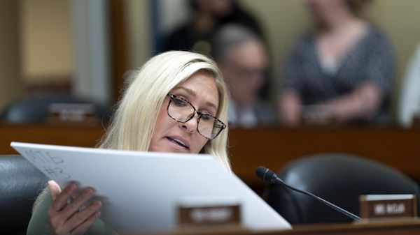 Rep. Marjorie Taylor-Greene, R-Ga., prepares to hold up explicit images and an airline confirmation made by Hunter Biden during a House Oversight and Accountability Committee hearing with IRS whistleblowers at the Capitol in Washington, Wednesday, July 19, 2023. - Sputnik International