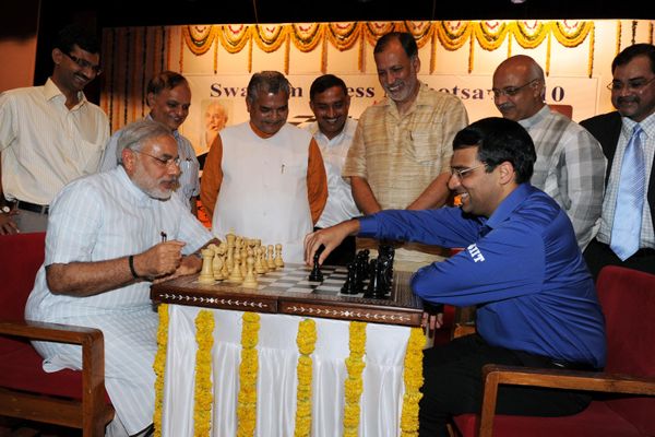 India's then-Gujarat state Chief Minister, Narendra Modi, on the left (seated), plays a game of chess with Indian chess champion Vishwanathan Anand at the Town Hall in Gandhinagar (around 30 km from Ahmedabad) on June 16, 2010. Mukherjee is on a one-day visit to Gujarat state. - Sputnik International