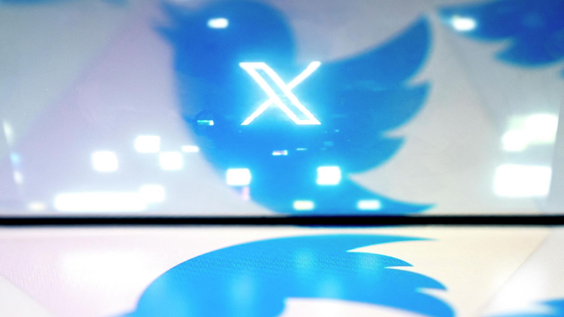 This illustration photo created in Washington, DC, on July 24, 2023, shows the new X Twitter logo reflected in the bird Twitter logo This illustration photo created in Washington, DC, on July 24, 2023, shows the new X Twitter logo reflected in the bird Twitter logo - Sputnik International, 1920, 11.08.2023