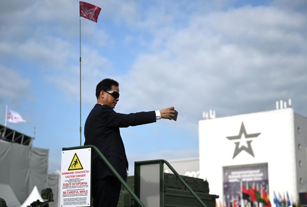A visitor takes a photo at the Army-2023 International Military-Technical Forum at the Patriot Exhibition and Convention Center. - Sputnik International