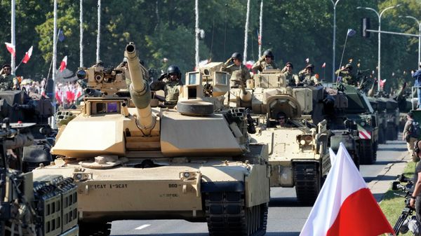US-made Abrams tanks purchased by Poland take part in a massive military parade to celebrate the Polish Army Day in Warsaw. August 15, 2023. - Sputnik International