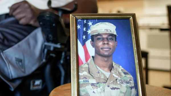 A portrait of American soldier Travis King is displayed as his grandfather, Carl Gates, talks about his grandson on July 19, 2023, in Kenosha, Wis. - Sputnik International