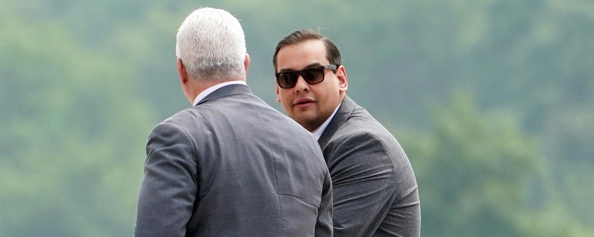 U.S. Rep. George Santos, right, R-N.Y., arrives to federal court alongside attorney Joseph Murray, Friday, June 30, 2023, in Central Islip, N.Y. Santos returned to court Friday for the first time since pleading not guilty last month to charges that he duped donors, stole from his campaign, collected fraudulent unemployment benefits and lied to Congress about being a millionaire. U.S. Rep. George Santos, right, R-N.Y., arrives to federal court alongside attorney Joseph Murray, Friday, June 30, 2023, in Central Islip, N.Y. Santos returned to court Friday for the first time since pleading not guilty last month to charges that he duped donors, stole from his campaign, collected fraudulent unemployment benefits and lied to Congress about being a millionaire. - Sputnik International, 1920, 17.08.2023