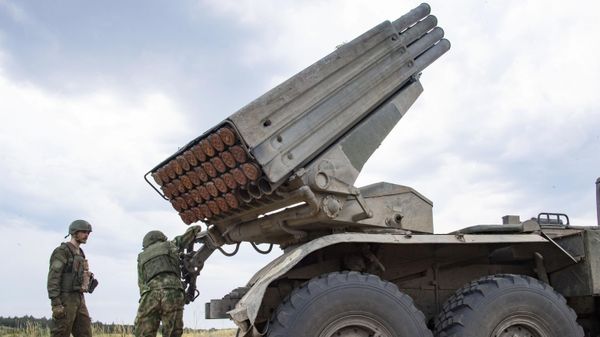  Russian servicemen are seen near the Grad multiple launch rocket system in Ukraine. File photo - Sputnik International