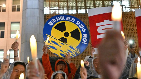 South Korea's main opposition Democratic Party members hold electric candles and a sign reading No Fukushima nuclear contaminated water! during a rally against Japan's plan to release treated water from the Fukushima nuclear plant, at the National Assembly in Seoul on August 23, 2023.  - Sputnik International