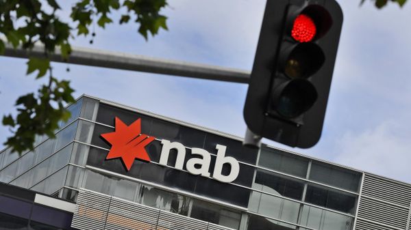 A sign adorns the headquarters of the National Australia Bank (NAB) in Melbourne November 5, 2020 after the NAB reported that its full-year after-tax profits had fallen by almost half, as the coronavirus pandemic continued to impact lenders Down Under. - Sputnik International