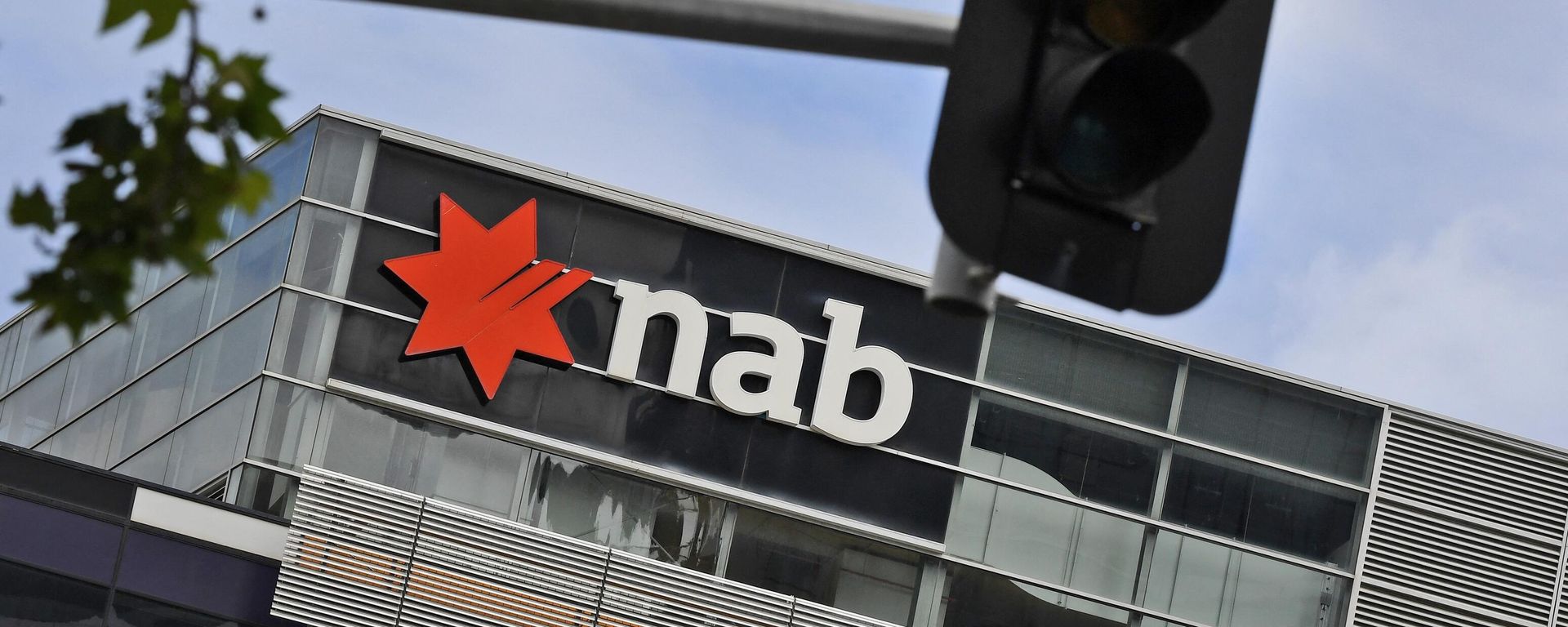 A sign adorns the headquarters of the National Australia Bank (NAB) in Melbourne November 5, 2020 after the NAB reported that its full-year after-tax profits had fallen by almost half, as the coronavirus pandemic continued to impact lenders Down Under. A sign adorns the headquarters of the National Australia Bank (NAB) in Melbourne November 5, 2020 after the NAB reported that its full-year after-tax profits had fallen by almost half, as the coronavirus pandemic continued to impact lenders Down Under. - Sputnik International, 1920, 05.09.2023