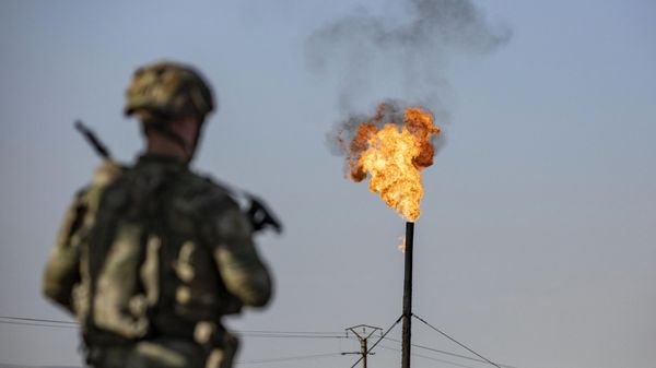 A US soldier patrols near an oil field in al-Qahtaniyah in Syria's northeastern Hasakah province, close to the border with Turkiye, on June 14, 2023 - Sputnik International