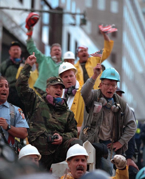 Rescue and emergency personnel rally around President George W Bush on Friday, 14 September 2001, during his visit to New York City. - Sputnik International