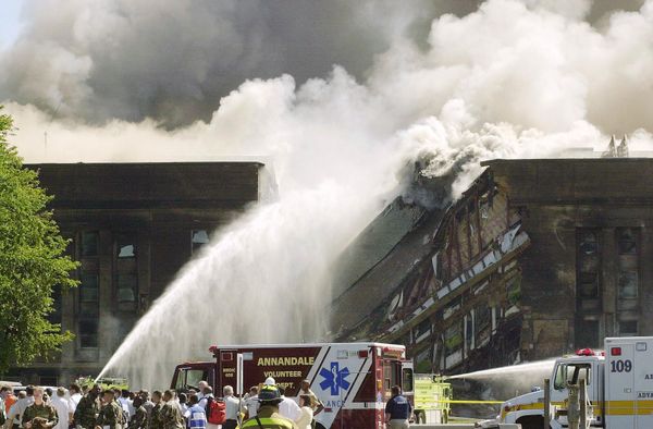 Firefighters struggle to contain the blaze after the hijacked American Airlines Flight 77, a Boeing 757-200, crashed into the Pentagon building. - Sputnik International