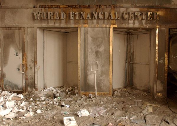 The World Trade Center sign stands smothered in ash and soot. - Sputnik International
