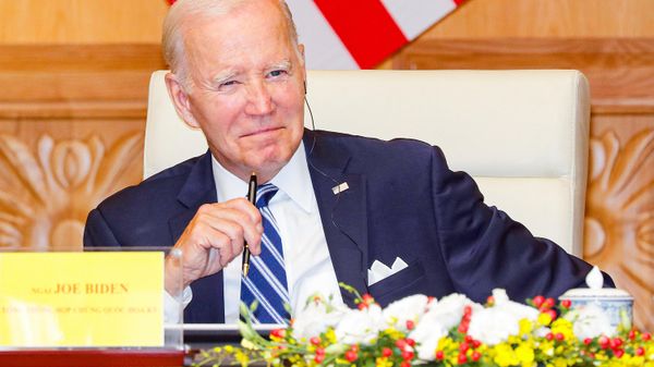 US President Joe Biden reacts during a meeting with Vietnam's Prime Minister Pham Minh Chinh (unseen) and CEOs at the Government Office in Hanoi on September 11, 2023.  - Sputnik International