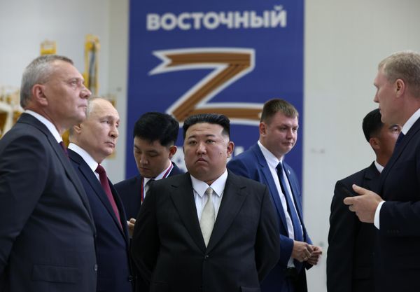 Vladimir Putin and Kim Jong Un listen to an employee guiding them who speaks about the characteristics of rockets at the Vostochny Cosmodrome, September 13, 2023. In the foreground, on the left: Yury Borisov, the director general of Roscosmos State Space Corporation. - Sputnik International
