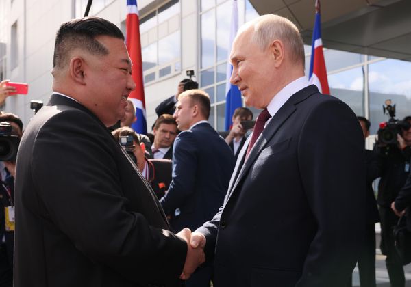 President Putin gives Chairman Kim a warm handshake at the Vostochny Cosmodrome, September 13, 2023. - Sputnik International