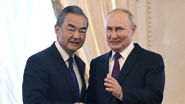 Russian President Vladimir Putin and Chinese Foreign Minister Wang Yi shake hands before a meeting at the Constantine (Konstantinovsky) Palace in Strelna near St. Petersburg, Russia, September 20 Russian President Vladimir Putin and Chinese Foreign Minister Wang Yi shake hands before a meeting at the Constantine (Konstantinovsky) Palace in Strelna near St. Petersburg, Russia, September 20 - Sputnik International