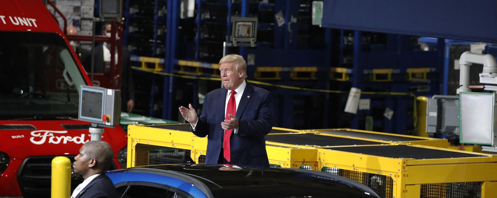 FILE - President Donald Trump claps as he walks to the podium to speak at Ford's Rawsonville Components Plant that has been converted to making personal protection and medical equipment, Thursday, May 21, 2020, in Ypsilanti, Mich. Former President Donald Trump will skip the second GOP presidential debate next week to travel to Detroit as the auto worker strike enters its second week. Trump is planning to speak with union members and will look to blunt criticisms from a United Auto Workers union leadership that has said a second Trump term would be a “disaster.” FILE - President Donald Trump claps as he walks to the podium to speak at Ford's Rawsonville Components Plant that has been converted to making personal protection and medical equipment, Thursday, May 21, 2020, in Ypsilanti, Mich. Former President Donald Trump will skip the second GOP presidential debate next week to travel to Detroit as the auto worker strike enters its second week. Trump is planning to speak with union members and will look to blunt criticisms from a United Auto Workers union leadership that has said a second Trump term would be a “disaster.” - Sputnik International, 1920, 22.09.2023
