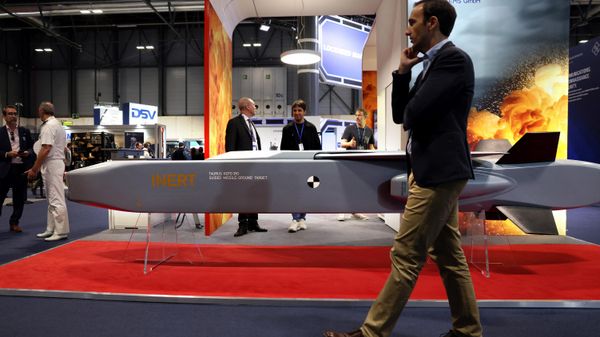 A visitor walks past a guide missile ground target KEPD 350 manufactured by the Swedish-German company Taurus at the International Defence and Security fair of Madrid, on May 17, 2023.  - Sputnik International