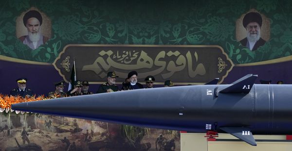 Iranian President Ebrahim Raisi, wearing a black turban in the center, listens to the Revolutionary Guard aerospace division commander Gen. Amir Ali Hajizadeh.  - Sputnik International