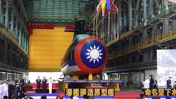 Taiwan's President Tsai Ing-wen, center, one of the three standing next to a covered submarine, attends the launching ceremony for domestically-made submarines at CSBC Corp's shipyards in Kaohsiung, Southern Taiwan, Thursday, Sept. 28, 2023.  - Sputnik International