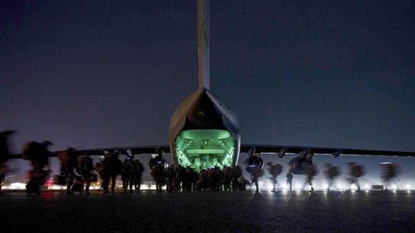 FILE - In this Aug. 30, 2021, file photo provided by the U.S. Air Force, soldiers, assigned to the 82nd Airborne Division, prepare to board a U.S. Air Force C-17 Globemaster III aircraft at Hamid Karzai International Airport in Kabul, Afghanistan. A State Department report says the department failed to do enough contingency planning before the collapse of the U.S.-backed government in Afghanistan. The review repeatedly blames the administration of former President Donald Trump for not doing enough planning or processing of visas after beginning the withdrawal.  - Sputnik International